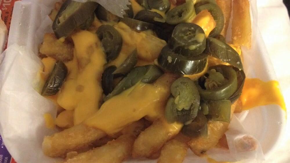 Chili & Cheese Fries · Covered with chili and cheese.