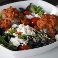 Meatball Salad · Romaine hearts, mixed greens, 2 Classic meatballs with bolognese, goat cheese, tomatoes, and...