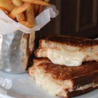 Grilled Cheese & French Fries · Rustic Panini Bread with Smoked Provolone & Montemore Cheddar Cheese.  Served with a side of...