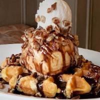 Belgian Waffle Sundae · Belgian liege waffle with vanilla bean ice cream, dark chocolate, and pecans topped with whi...