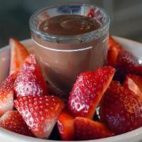 Artisinal Liqud Chocolate · Served with fresh strawberries.