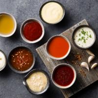 Extra Side Of Wing Sauce (4Oz) · Choose between buffalo sauce, Nashville hot, Caribbean jerk, garlic parmesan sauce, honey sr...