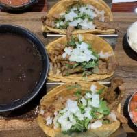 Tacos De Carne Asada · Michelada. Grilled Angus steak in three soft corn tortillas with onions, and cilantro. Tomat...
