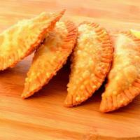 Empanadas · Fried flour pastry with filling. Choice of beef , chicken or cheese.