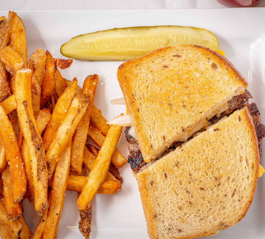 Patty Melt · Beef patty with melted American cheese and caramelized onion, all served between two slices of grilled rye bread. Served with potato chips or French fries.