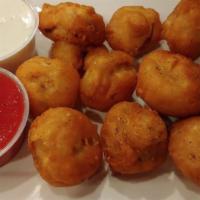 Fried Mushrooms · Vegetarian. Battered and fried mushroom caps. Served with a side of ranch.