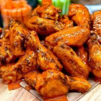 Bone-In Wings - 48 · Jumbo bone-in chicken wings, deep fried and tossed in any of our signature sauces or dry rub...