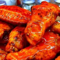 Bone-In Wings - 18 · Jumbo bone-in chicken wings, deep fried and tossed in any of our signature sauces or dry rub...