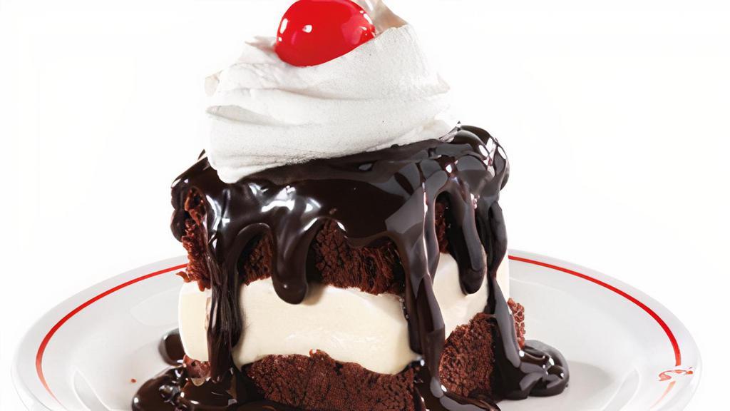 Hot Fudge Cake · Vanilla Ice Cream sandwiched between two hot fudge cakes, smothered with hot fudge and topped with whipped topping and a cherry brought to you by our friends at Frisch's Big Boy.