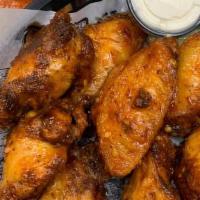 Wings · Traditional bone-in served with celery and your choice of ranch or blue cheese. Make them bo...