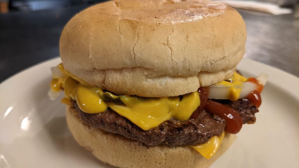 Single Bobert With Cheese · One ¼ lb. Bobert burger topped with onions, pickles and two slices of American cheese on a hamburger bun.