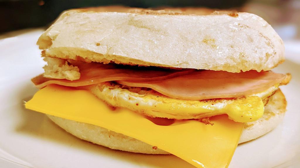 Ham Egg & Cheese Bobmuffin Combo · Freshly cracked egg on a toasted English Muffin topped with real butter, ham slices and melty American cheese.