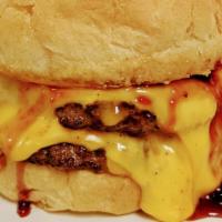 Pb&J Bobert · Two ¼ lb. Bobert burgers topped with two slices of American cheese, grape jelly and creamy p...