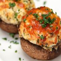 Stuffed Mushrooms · Mushroom caps stuffed with a blend of cheeses and prosciutto in a garlic white wine sauce.