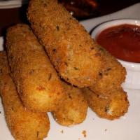 Mozzarella Cheese Sticks · Five tasty mozzarella sticks, hand-breaded, fried golden brown and served with our own marin...