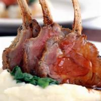 Rack Of Lamb · Grilled to perfection and served with blackberry Demi sauce, au gratin mashed potatoes and g...