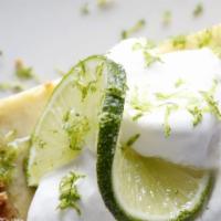 Key Lime Pie · Florida Key Lime Pie with graham cracker crust & topped with whipped cream.