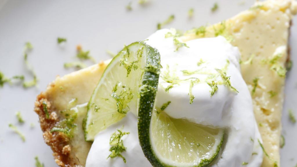 Key Lime Pie · Florida Key Lime Pie with graham cracker crust & topped with whipped cream.