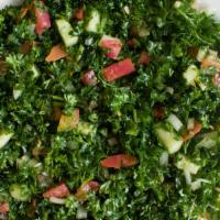 Tabouleh Salad · Freshly diced tomatoes, onions, parsley, green pepper and cracked wheat gently tossed with o...