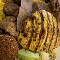 Combination Feast · Combination of shish kabob, kefta kabob, beef shawarma, chicken tender and falafel served wi...