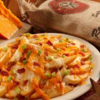 Cheese Fries · French fries layered in a blend of cheeses, topped with bacon and green onions. Served with ...