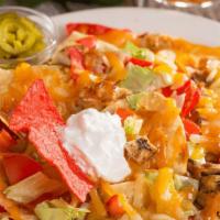 Chipotle Chicken Nachos · 2340 cal. Crispy nacho chips covered in a blend of cheeses, refried beans, chicken, rice, an...