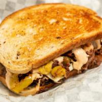 Baba'S Hungry · Grilled rye bread, baba's sauce, spicy mustard, corned beef, pastrami, swiss and pepper jack...