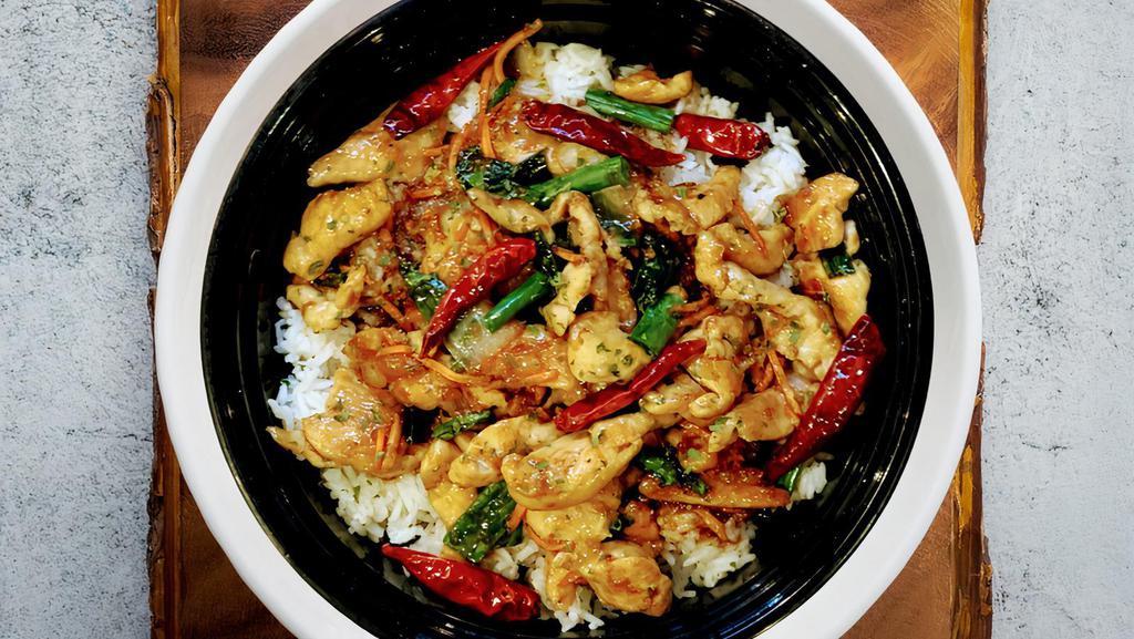 Sweet Stir Fry Chicken · This dish is made with white meat chicken, thinly sliced, stir fry in a sweet sauce, carrots, and onions. Served over a bed of white rice.