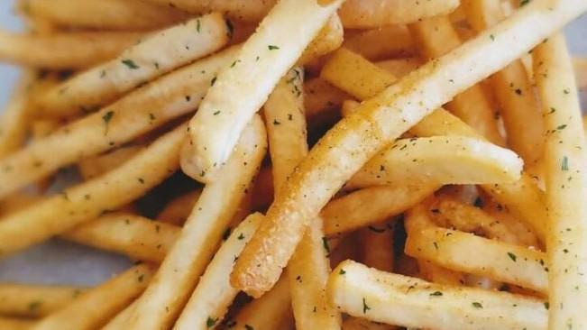 Seasoned Crispy Fries · Golden crispy fries, seasoned with a savory seasoning.