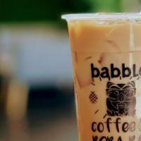 Iced Babble Milk Tea · Our house special blend of black teas made with a non-dairy creamer.