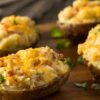 Cheese & Bacon Potato · Large Idaho baked potato fluffed and served with Rax cheddar cheese sauce.