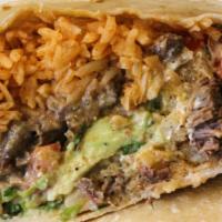 Super Burrito · Stuffed with beans, rice, Chihuahua cheese, lettuce, pico de gallo, sour cream, and salsa ve...
