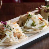 Fish Tacos · Mahi mahi, cabbage-jicama slaw, avocado, baja sauce, lime, salsa guajillo.