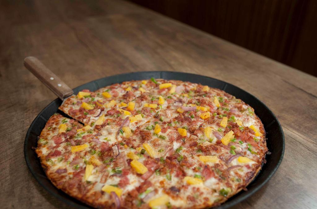 The Island · Bbq sauce, ham, bacon, pineapple, red onion, green pepper and topped with cinnamon.