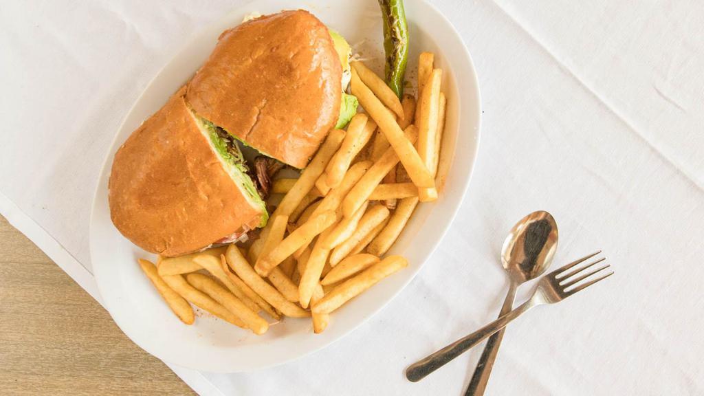 Tortas Mexican Sandwich · Bread, beans, choice of meat, lettuce, tomato, onion, avocado, hot sauce, mayo and a side of fries.