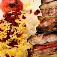 Kabob Makhsous Entree · A juicy double layer kabob made of the filet mignon Kabob Barg, topped with seasoned ground ...