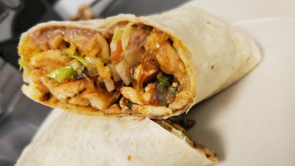 Burrito California · Big burrito filled with grilled fajita chicken or steak, rice, beans, lettuce, pico de gallo and sour cream.