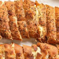 Cheezie Bread · Small-Garlic butter with mozzarella and cheddar cheeses sprinkled with parmesan