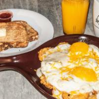 German Skillet · Smoked sausage, farm-fresh scrambled eggs served on potato pancakes with cheddar cheese & ho...