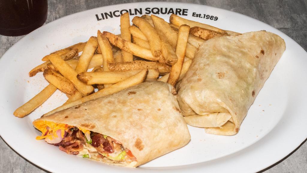 Grilled Chicken Wrap · All-natural hormone-free tender grilled chicken breast, bacon, tomatoes, onions, lettuce, cheese & honey ranch dressing.