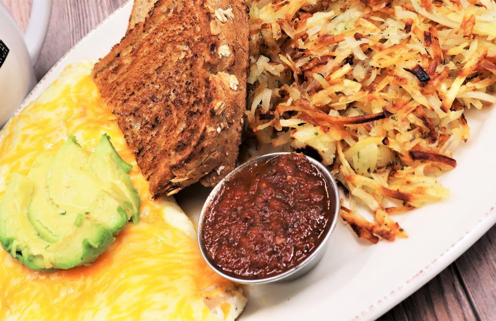 Persea Americana Omelet · Egg whites, roasted chicken, diced green chiles, roasted tomato, onion, and cheddar-jack cheese. Topped with fresh avocado and served with a side of salsa.