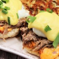 Southern Benedict · Toasted biscuit, pimento cheese, pulled pork and poached eggs. Topped with crafted hollandai...