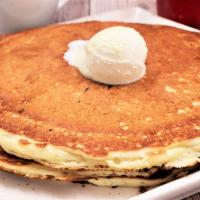Pancakes · House blend buttermilk pancake mix, griddled until perfect. Served with syrup and whipped bu...