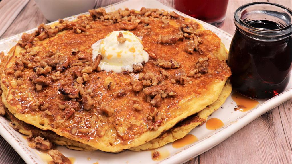 Sweet Potato Pancake · Topped with whipped butter, candied pecans, and drizzled with caramel sauce.