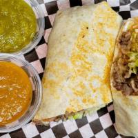 Gourmet Steak Burritos · Chopped Grill Steak With Mexican cheese, Lettuce, Beans, Tomatoes, Sour cream.