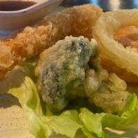 Shrimp Tempura Roll · Shrimp tempura, avocado, cucumber topped W. eel sauce. **Hand Roll Not Available**