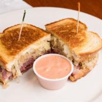 Corned Beef Reuben · Served with homemade sauerkraut and swiss on grilled rye. Thousand Island on the side.