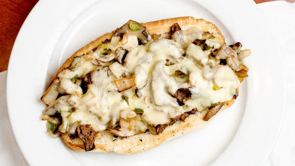 Philly Steak Sub · Shredded steak sautéed with green peppers, mushrooms, onions, and melted swiss cheese.
