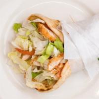 Chicken Finger Pita · Sliced chicken with shredded lettuce, tomato, and melted American and Swiss cheese.