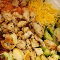 Mike'S Cobb Salad · Tender cubes of grilled chicken breast, real bacon bits, shredded cheese, diced tomatoes, cu...